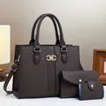 Detail shot of deep brown textured 3-piece bag set with gold hardware and strap - Handbag, Clutch And Card Holder / Medium / Coffee