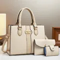 Detailed view of beige 3-piece bag set with woven texture and interlocking gold logo - Handbag, Clutch And Card Holder / Medium / Off White