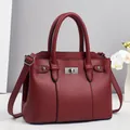 Deep red lychee textured leather tote bag with silver hardware and adjustable strap - Red