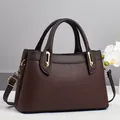 Brown lychee leather tote bag with round handles and adjustable strap for women - Coffee