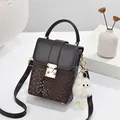 Deep brown snake skin pattern crossbody phone bag with vintage gold clasp and plush charm - Coffee