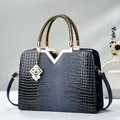Deep blue faux crocodile leather handbag with gold V-ornament and braided handles - Sapphire Blue