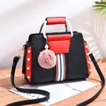 Contrast color women's handbag with white U-shaped handles and pink fur ball pendant - Black