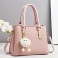Pink faux leather shoulder bag with diagonal texture and cute white plush ball pendant - Pink
