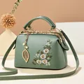 Retro mint green handbag with daisy floral embroidery and gold leaf pendant accessory - 24*12*15CM / Green