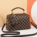 Brown checkerboard satchel bag with floral details and a 3D flower charm accessory - Brown