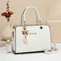 Elegant white snake skin tote bag with pearl bow pendant and detachable shoulder strap - White
