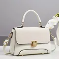 Elegant cream macaron handbag with textured flap, gold lock and detachable shoulder strap - Off White