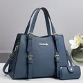 Classic navy blue textured tote bag with top handles and matching mini wallet set - Blue