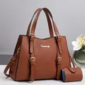 Detail of caramel pebbled leather tote bag with gold hardware and matching pouch - Earthy Yellow