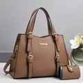 Detailed shot of brown tote bag with lychee pattern texture and gold brand hardware - Khaki