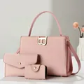Detailed view of 3-piece pink tote set with textured embossing and gold B-buckle hardware - Pink