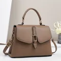 Elegant brown pebbled leather handbag with gold clasp and adjustable shoulder strap - Khaki
