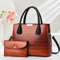 Brown crocodile pattern tote and clutch handbag set with black handles and gold hardware - Earthy Yellow