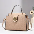 Detail of beige woven texture handbag with vintage round gold metal buckle ornament - 25cm x 10cm x 21cm / Khaki