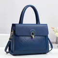 Navy blue lychee leather handbag with quilted stitching and gold ring buckle - Blue