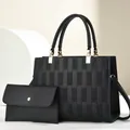 Elegantes schwarzes Handtaschen-Set mit Prägestreifen und passender kleiner Umschlagtasche - Handtaschen- und Clutch-Set / Schwarz