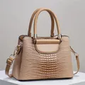 Classic khaki crocodile pattern handbag with gold hardware and adjustable strap - Khaki