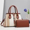 Detail view of striped fabric tote bag with brown leather trim and matching zip wallet - Two-Piece Set / White