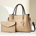 Detail of vintage tote bag set with textured lychee grain and pearl moon charm - Khaki