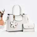 White faux crocodile bucket bag set with matching wallet and floral charm ornament - Off-white