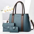 Detailed set of 3 textured blue leather handbags with contrast dark brown handles and straps - Blue