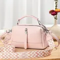Pink lychee texture crossbody bag with a wide woven strap and silver hardware accents - 24cmx10cmx14cm / Pink
