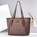Brown textured woven tote bag with dark leather trim and golden metal hardware - Coffee