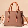 Women's dual-tone tote bag in orange-brown and light khaki with metal bar detail - Fabric-look Texture Earth Yellow