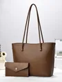 Large dark brown diagonal embossed tote bag set with matching envelope pouch on desk - Solid Color / Brown