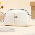 Elegant white shell-shaped shoulder bag with silver hardware and double zipper detail - Off White