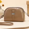 Chic khaki faux leather small crossbody bag for women with silver bow hardware detail - Khaki