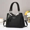 Large black lychee pattern tote bag with star pendant and removable crossbody strap - Black