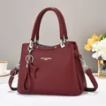 Fashionable burgundy leather tote bag with star charm and adjustable shoulder strap - Burgundy