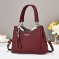 Burgundy litchi texture handbag with double handles and silver metallic arch detail - Red