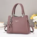 Elegant purple pebbled leather tote bag with silver star charm and dual handles - Grey Purple