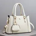 Chic beige lychee grain tote bag with gold hardware and matching mini coin purse - Off-white