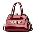 Deep red glossy patent leather handbag with sparkling rhinestones and gold hardware - Red