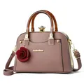 Pink shell handbag with amber handles, lychee leather texture and rose charm decoration - Pink