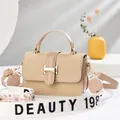 Beige woven crossbody bag with wide Beauty 1987 jacquard strap and gold hardware - Apricot