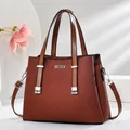 Brown leather tote bag for women with silver metal logo and dual handle straps - Khaki/Earth Yellow