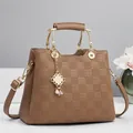 Detail of checkered embossed brown tote bag with gold handle and pearl chain charm - 26x12x20cm / Dark Khaki