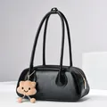 Minimalist black leather texture shoulder bag with cute plush cloud charm on studio prop - Black / 31*9*13