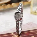 Macro shot of silver oval quartz watch dial with sunray texture on vintage background - Radiant Texture Style / Silver Band With Gray Dial