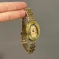 Elegant gold quartz watch for women with oval dial and roman numerals on metal strap - Gold Strap Gold Dial