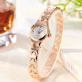 Elegant rose gold women's quartz watch with a slim chain strap and white rhinestone dial - Rose Gold Band White Dial