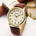 Classic gold quartz watch with dark brown leather strap and champagne dial - Brown Strap Men
