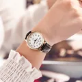 Women's quartz watch with gold metal case, white dial and black leather strap - Black Women's Style