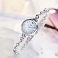 Elegant silver bracelet watch for women featuring a wavy hollow design with crystal accents - Silver Band White Dial