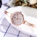 Elegant rose gold women's watch with a pink glitter dial and slim bracelet strap - Gold Band Light Gold Dial
